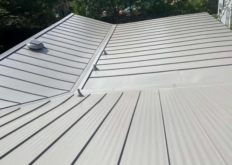 Solar attic fan installed on a metal roof for Roof Ventilation in Truckee